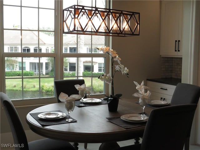 164 Colonade Cir Unit 1307, Naples, FL 34103 - dining area featuring a healthy amount of sunlight