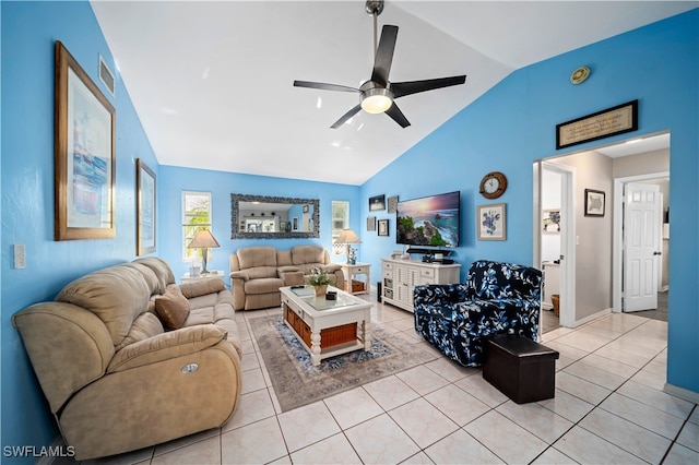 tiled living room with high vaulted ceiling and ceiling fan