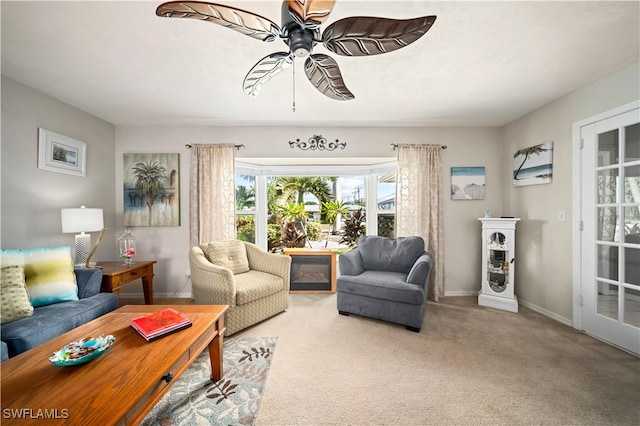 living room featuring light colored carpet and ceiling fan