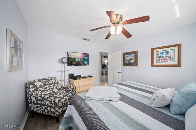 bedroom featuring dark wood-type flooring and ceiling fan