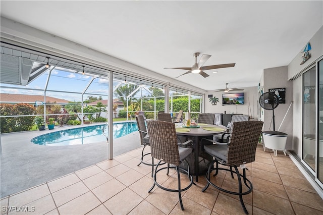 view of swimming pool featuring ceiling fan