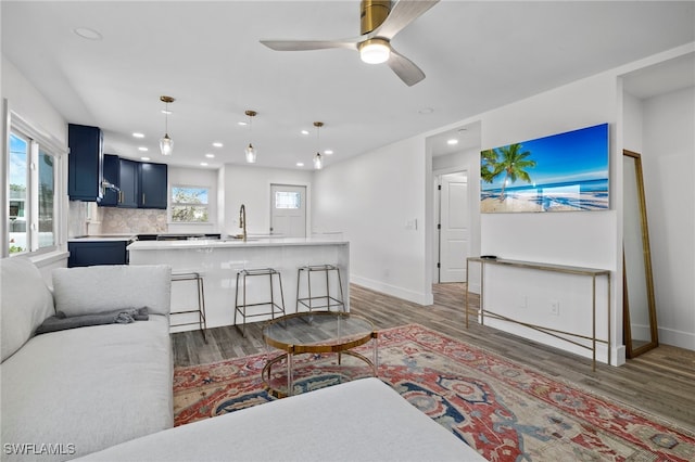 living room with ceiling fan, dark wood-style flooring, recessed lighting, and baseboards