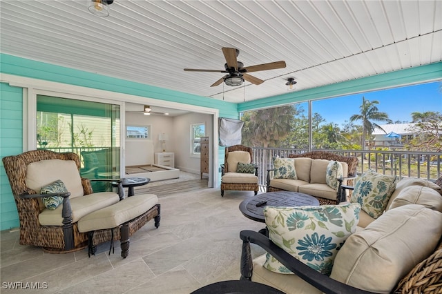 sunroom / solarium with ceiling fan