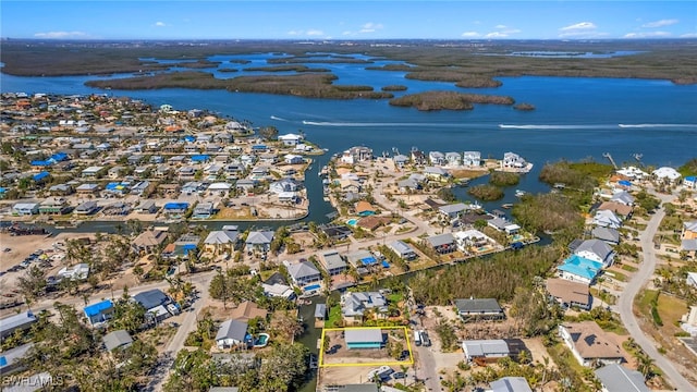 aerial view with a water view and a residential view