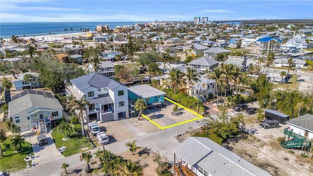 birds eye view of property with a water view and a residential view