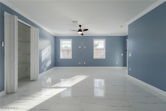 interior space with crown molding and ceiling fan