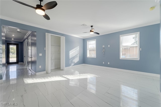 empty room with crown molding and ceiling fan