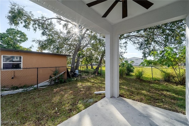 view of yard featuring ceiling fan