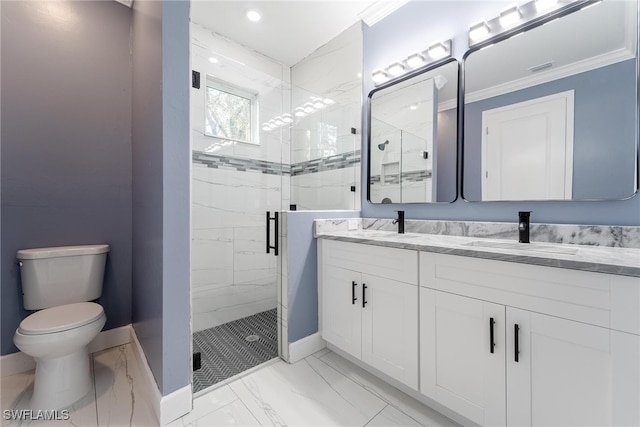 bathroom featuring toilet, crown molding, a shower with shower door, and vanity