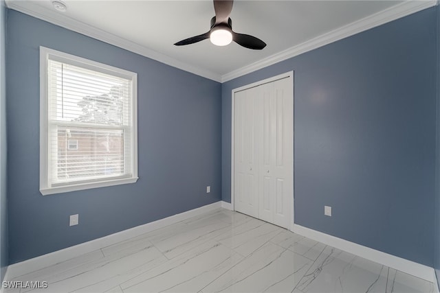 unfurnished bedroom featuring ornamental molding, multiple windows, a closet, and ceiling fan