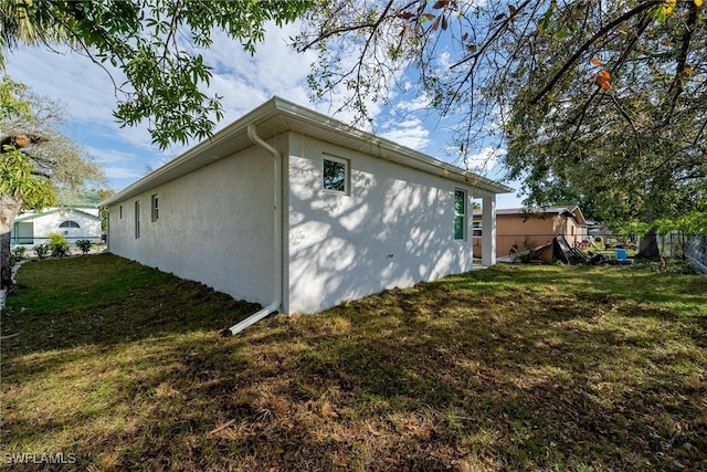 view of property exterior featuring a yard