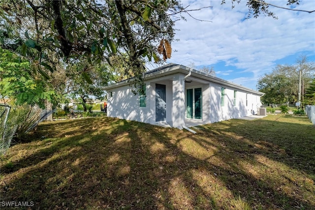 view of side of property featuring a yard