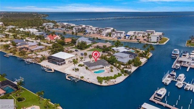 birds eye view of property with a water view