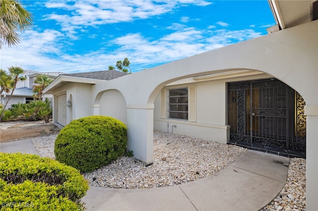 property entrance featuring a garage