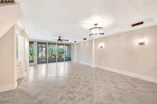 empty room with expansive windows, ceiling fan with notable chandelier, and ornamental molding