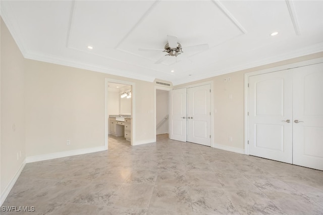 unfurnished bedroom featuring connected bathroom, two closets, ceiling fan, and crown molding