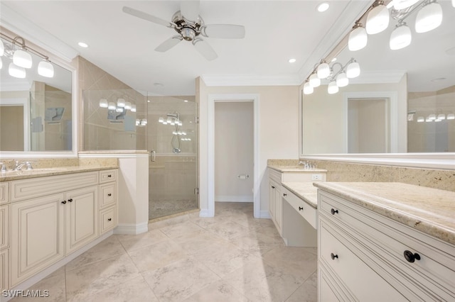 bathroom with ornamental molding, ceiling fan, walk in shower, and vanity