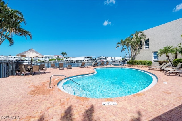 view of swimming pool featuring a patio area