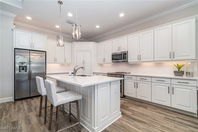 kitchen featuring appliances with stainless steel finishes, dark hardwood / wood-style flooring, sink, and white cabinets