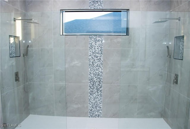 bathroom with a tile shower