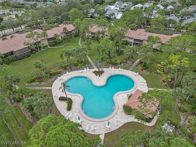 view of swimming pool with a residential view