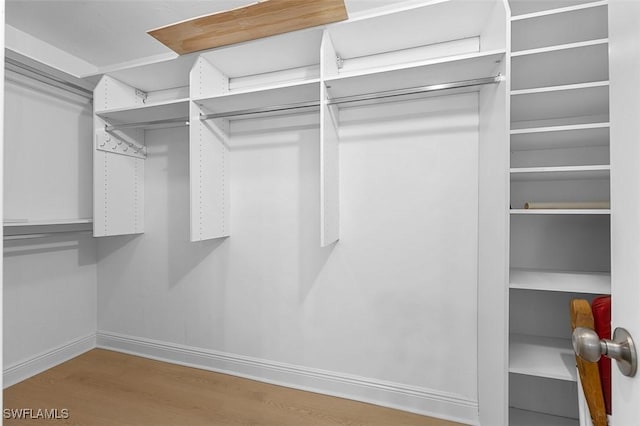 spacious closet with wood finished floors