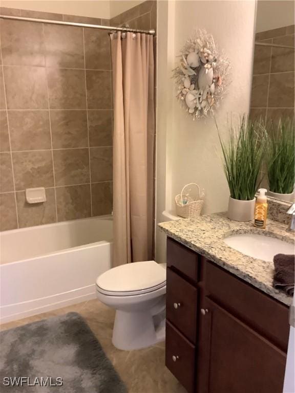 full bathroom featuring shower / bath combo, vanity, toilet, and tile patterned floors