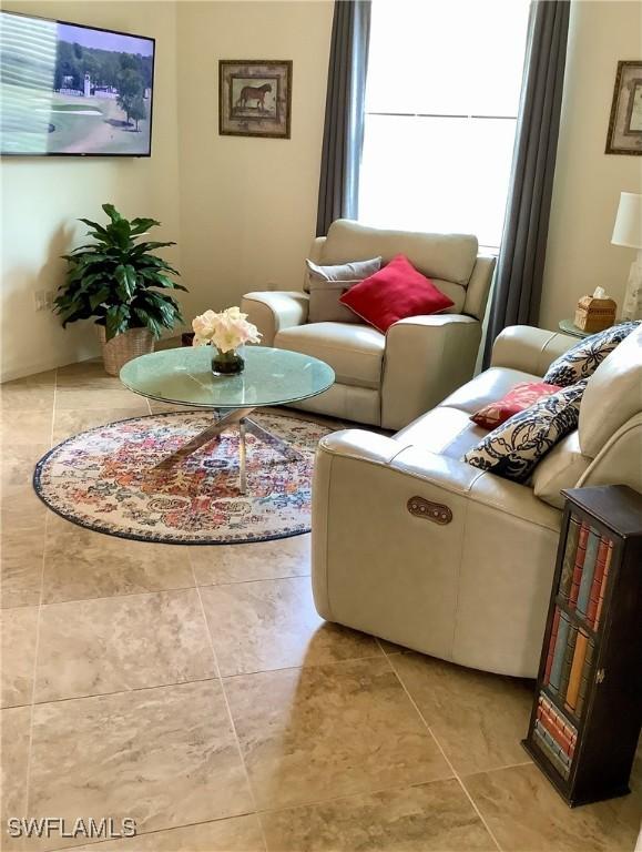 living room with light tile patterned floors