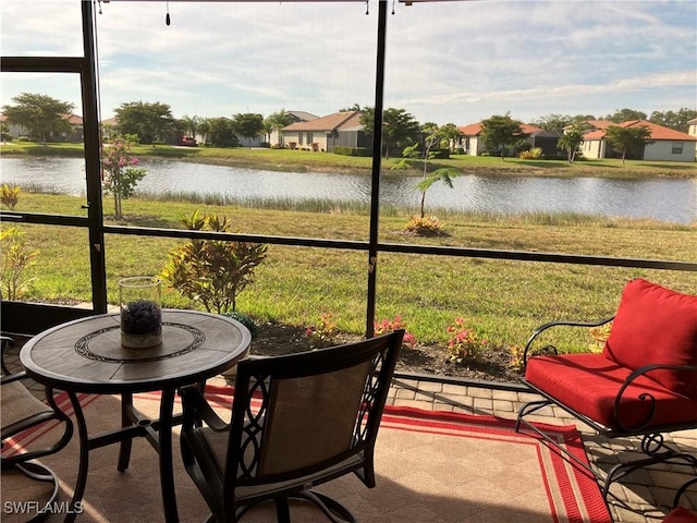 sunroom with a water view