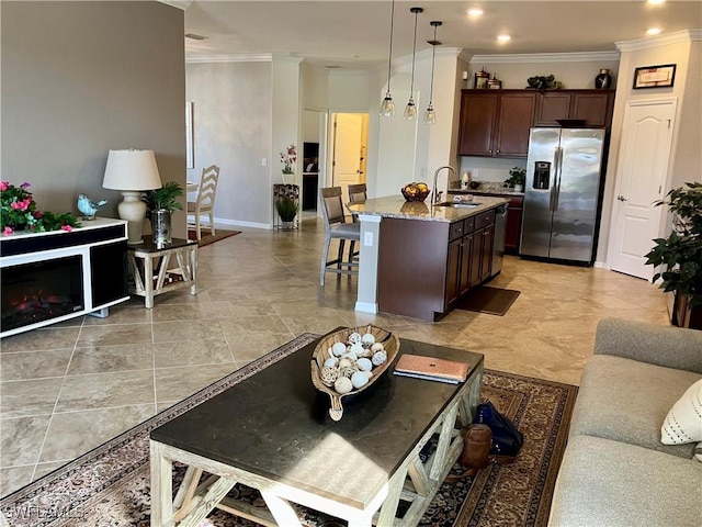 living room featuring crown molding and sink