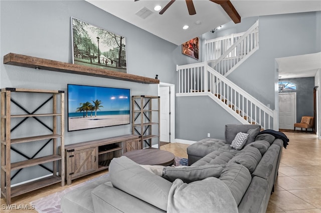 living room with beam ceiling, high vaulted ceiling, light tile patterned floors, and ceiling fan