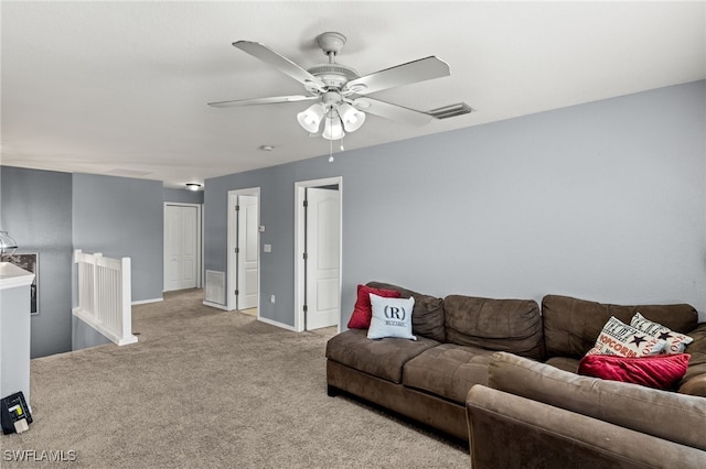 living room with light carpet and ceiling fan