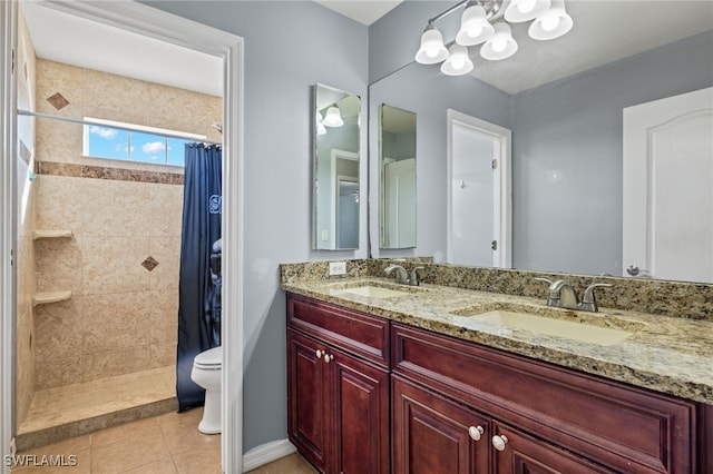 bathroom with toilet, walk in shower, vanity, and tile patterned floors