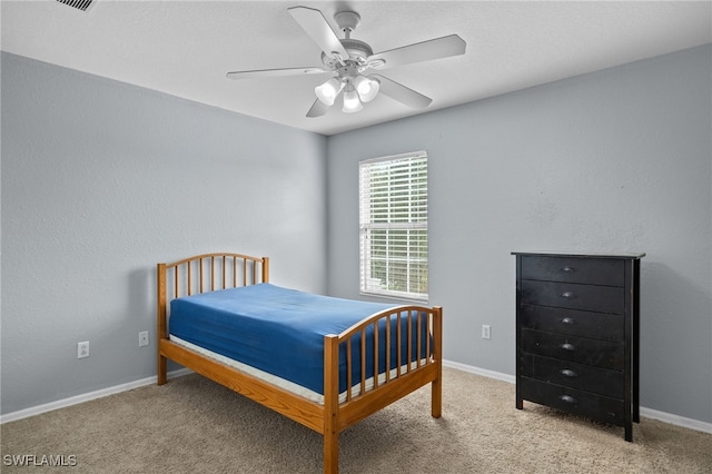 carpeted bedroom with ceiling fan