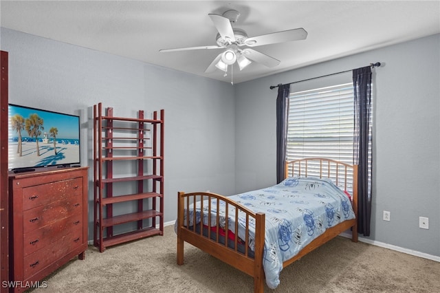 bedroom featuring light carpet and ceiling fan