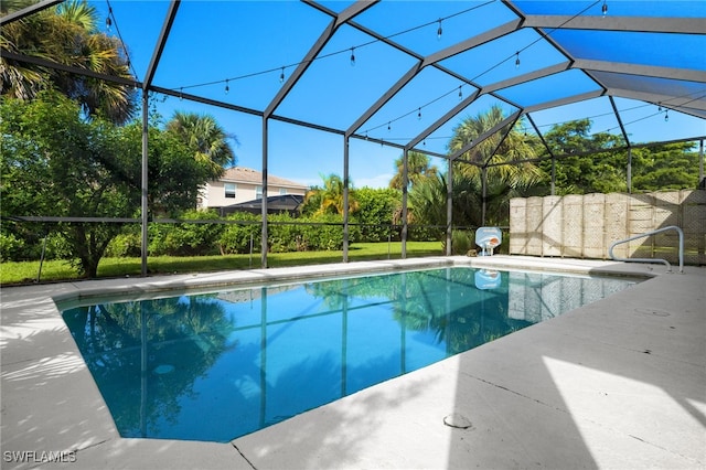 view of pool featuring a patio and glass enclosure