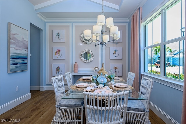 dining area with lofted ceiling, ornamental molding, a chandelier, and dark hardwood / wood-style flooring