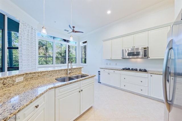 kitchen featuring crown molding, sink, appliances with stainless steel finishes, and white cabinetry