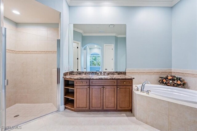 bathroom with crown molding, vanity, plus walk in shower, and tile patterned flooring