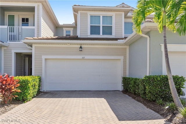 exterior space featuring decorative driveway