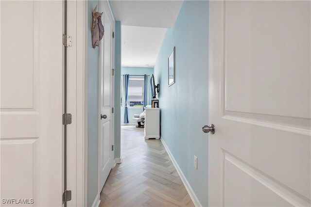 corridor featuring light parquet floors