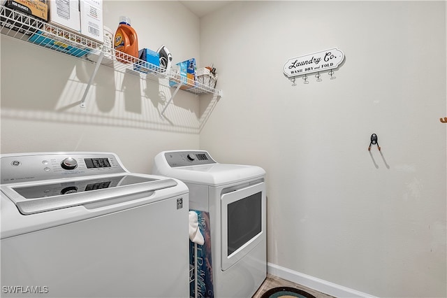 laundry area featuring washing machine and clothes dryer