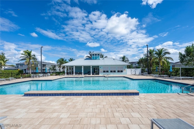 view of swimming pool featuring a patio area