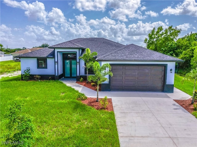 view of front facade featuring a front lawn and a garage