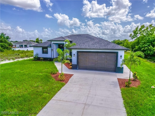 view of front of home with a garage and a front yard