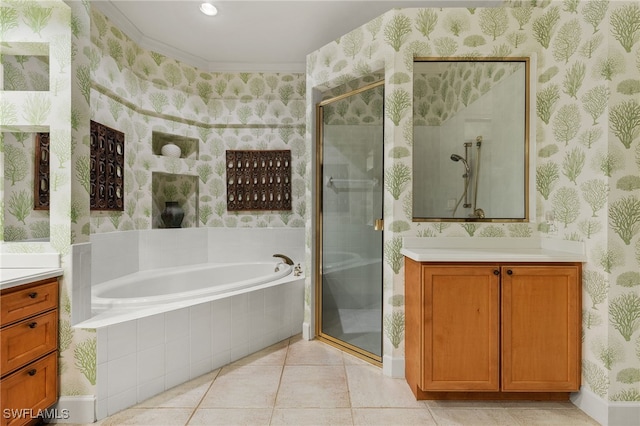 bathroom featuring tile patterned flooring, vanity, and separate shower and tub