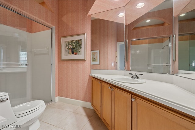 bathroom with vanity, toilet, tile patterned flooring, vaulted ceiling, and a shower with door