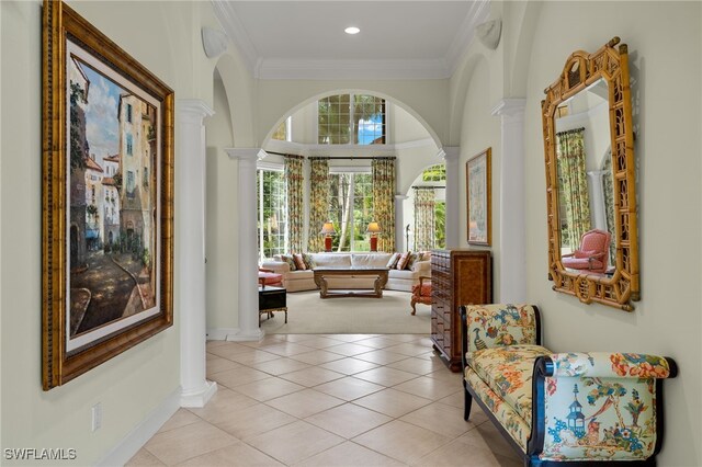 7005 Verde Way, Naples, FL 34108 - hallway with recessed lighting, arched walkways, light tile patterned floors, ornamental molding, and ornate columns