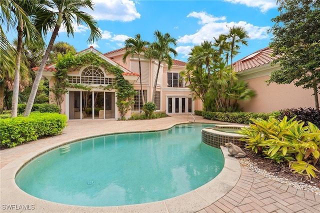 view of pool featuring a patio, french doors, and central air condition unit