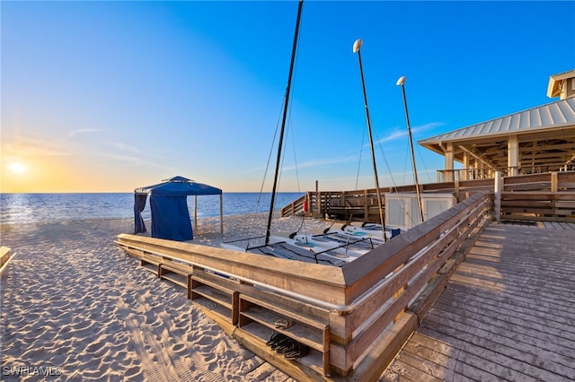 dock area featuring a view of the beach and a water view